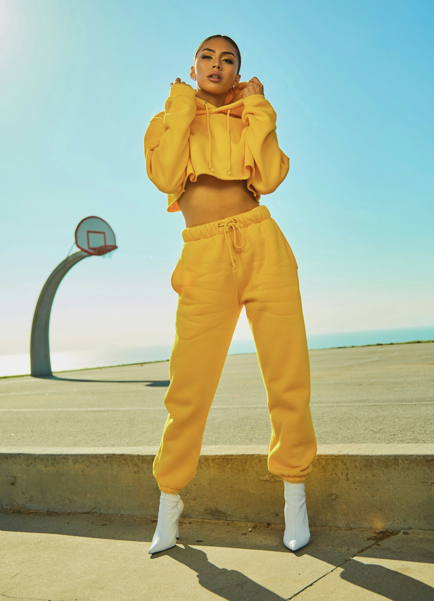 Fashion model in wearable apparel on set