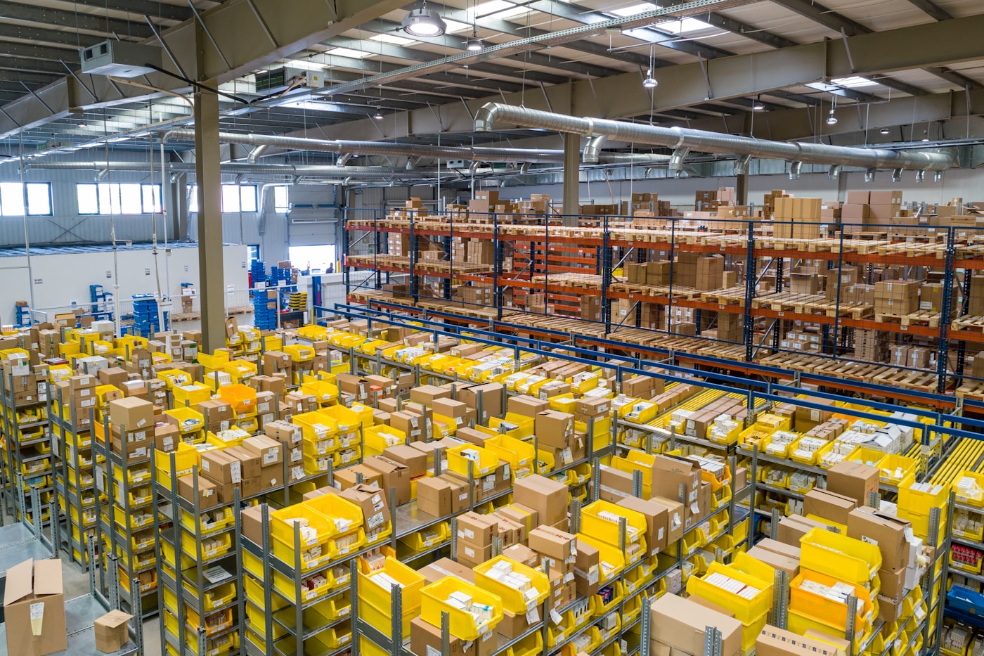 Warehouse shelves stacked with shipping boxes