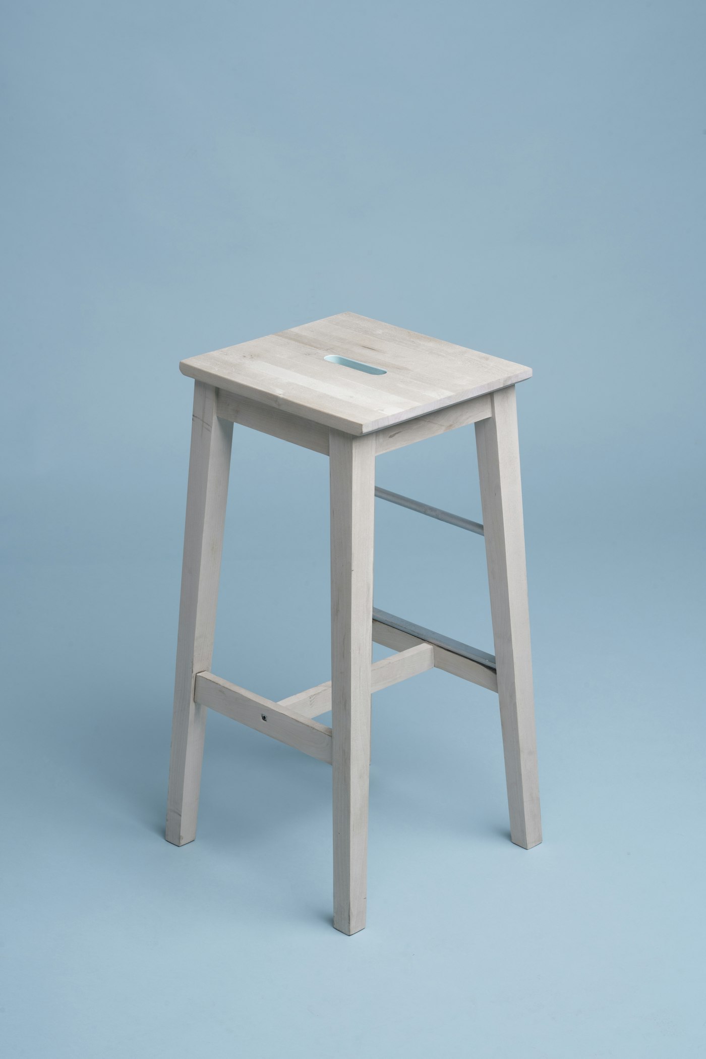 Minimal white stool product display